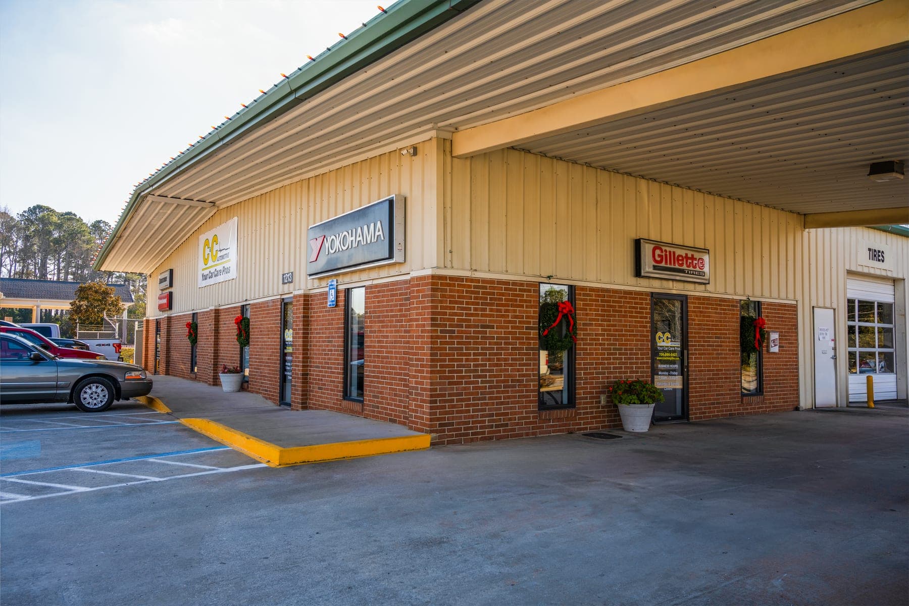 The C&C Automotive Thomson shop at 1213 Washington Road, with its brick storefront, Your Car Care Pros sign and covered service bay.